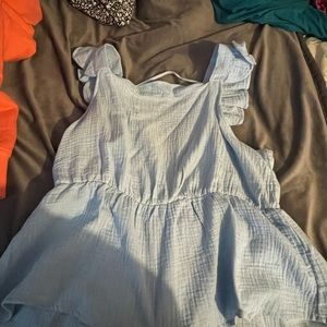 Sleeveless open back baby blue shirt